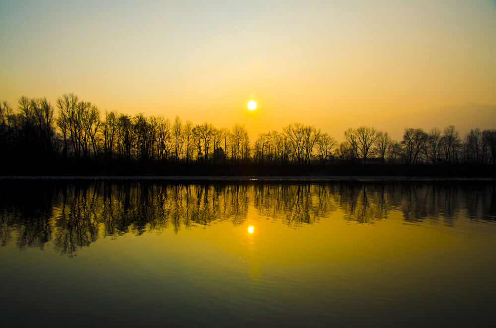 beautiful-sunset-scenery-lake-with-silhouettes-trees-reflected-water