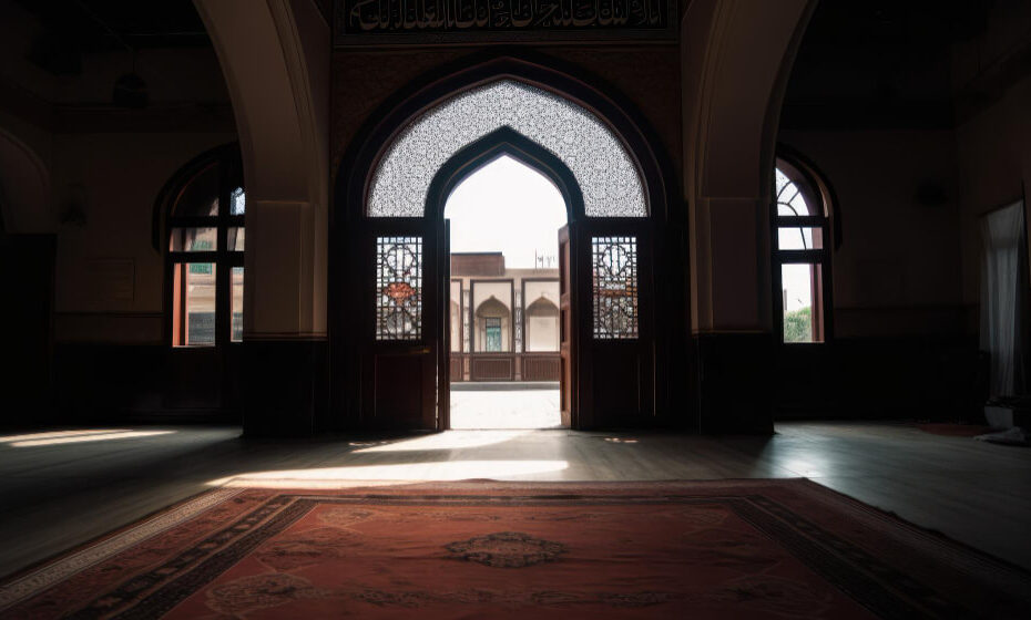 door-that-is-open-room-with-rug-that-says-door-mosque