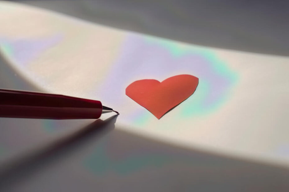 red-paper-heart-white-surface-paper-wooden